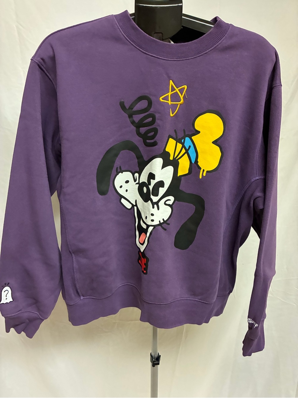 Purple Disney 100/H&M Goofy crewneck sweatshirt designed by artist Trevor Andrew